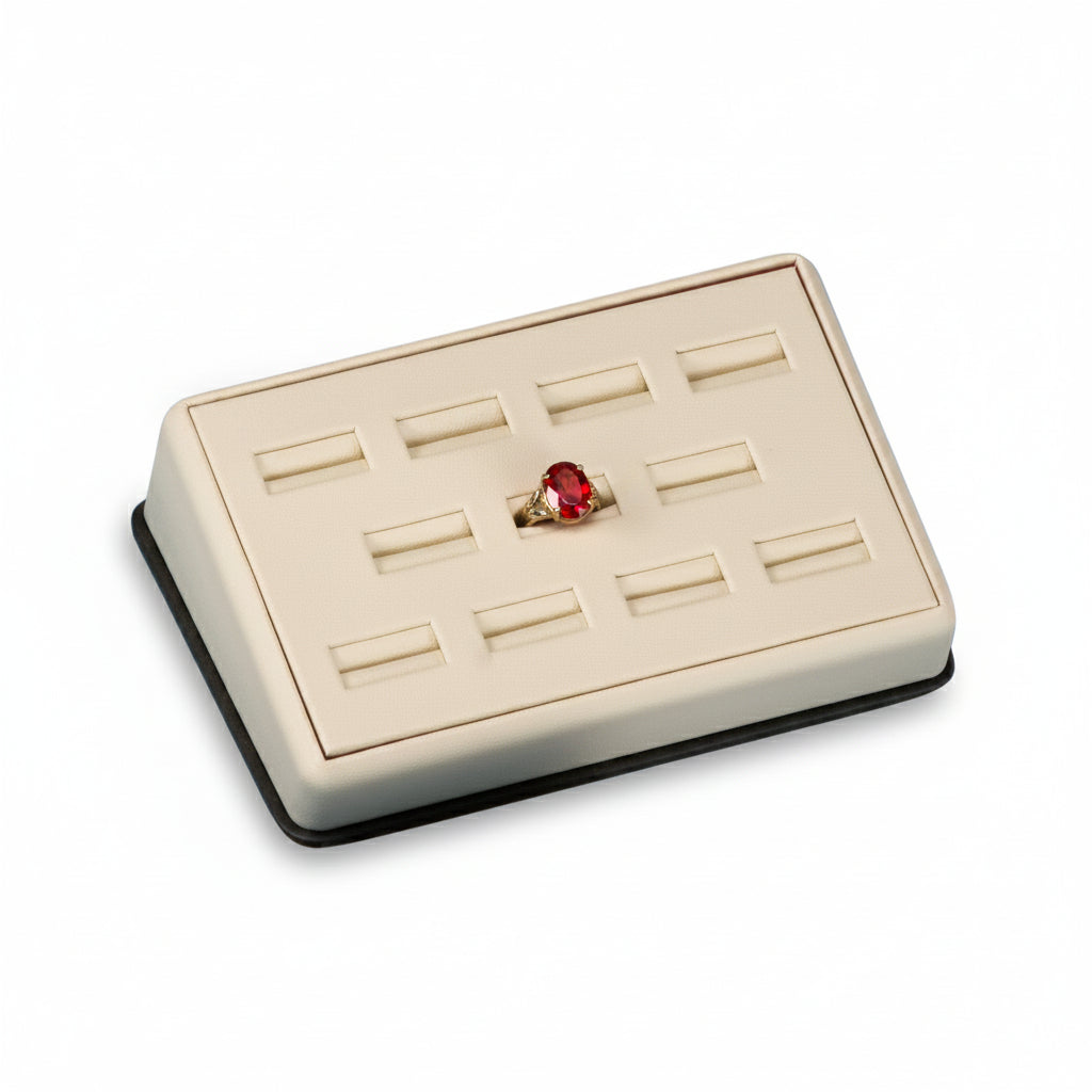 A chocolate and beige leatherette ring display stand with multiple slots for rings, closed and secure.