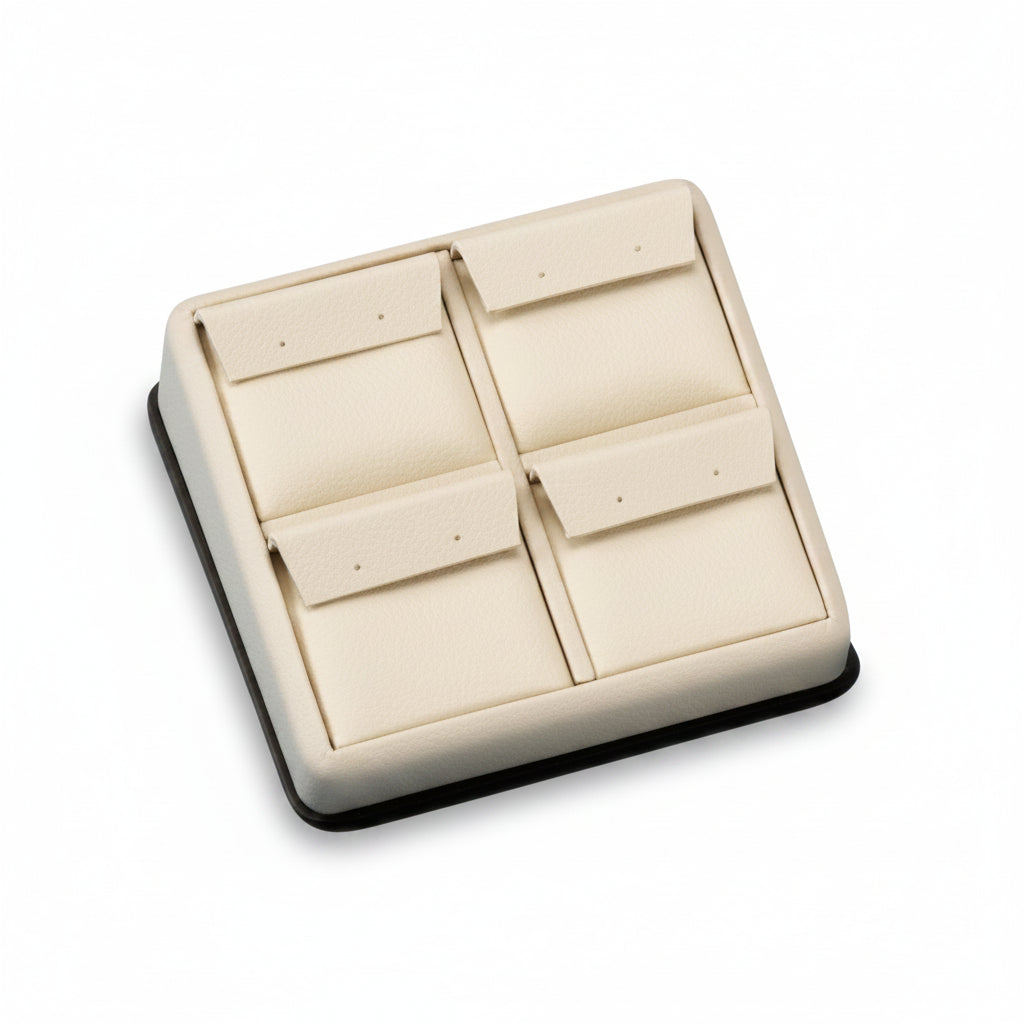 A chocolate and beige leatherette 4 earring stand with a soft, cushioned interior.