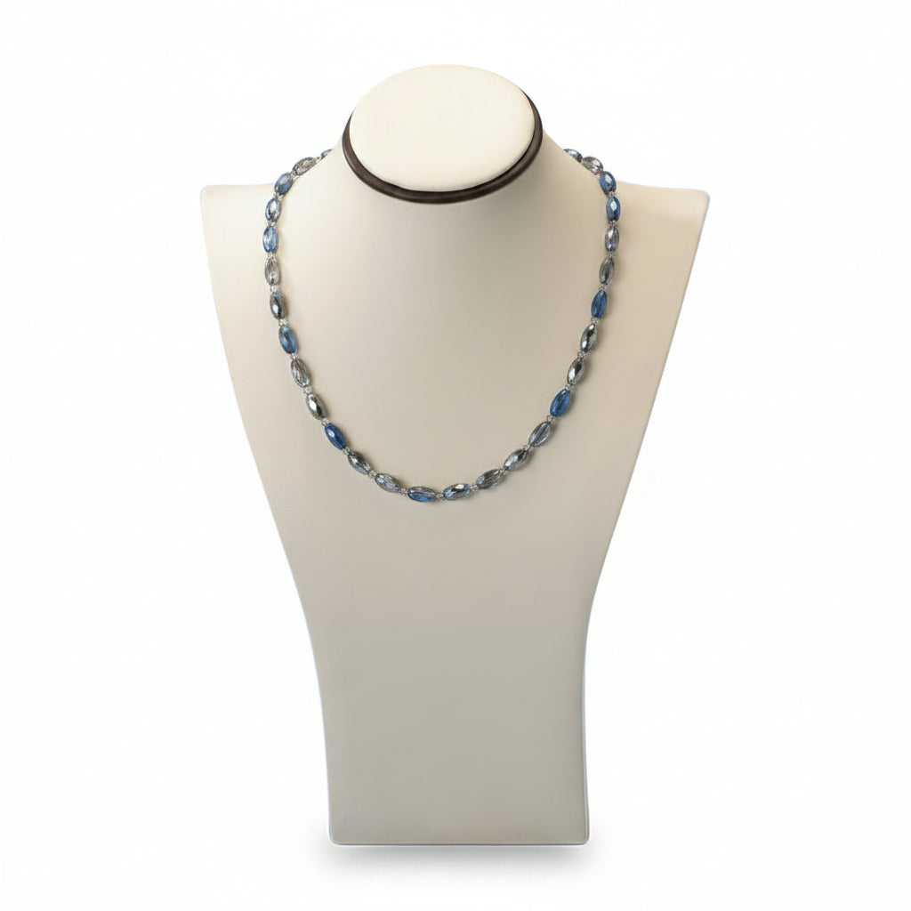 An X-Large neckform with a chocolate and beige leatherette finish, displaying a necklace.