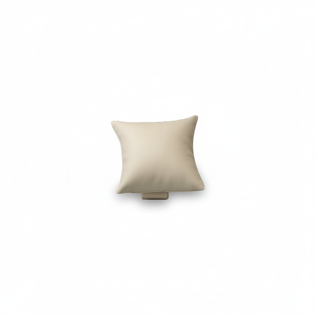 A chocolate and beige leatherette pillow-shaped display case for jewelry.