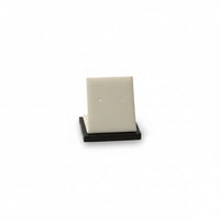 A chocolate/beige leatherette short earring stand with a soft, cushioned surface.
