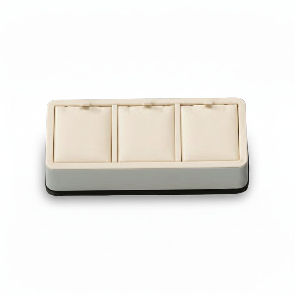 A chocolate and beige leatherette 3 pendant stand with three compartments, each cushioned to hold jewelry or accessories.