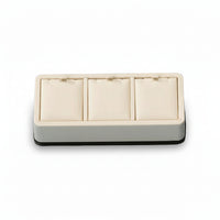 A chocolate and beige leatherette 3 pendant stand with three compartments, each cushioned to hold jewelry or accessories.
