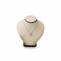 A chocolate and beige leatherette neckform displaying a necklace, with a square base and a soft, cushioned surface.