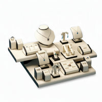 Jewelry display set with various pieces on a white background