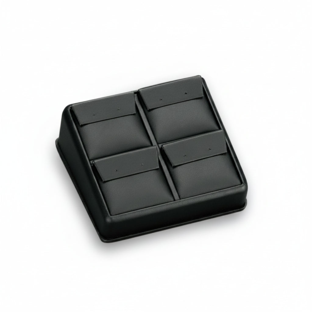 Black leatherette earring stand with four compartments for displaying earrings or pendants.