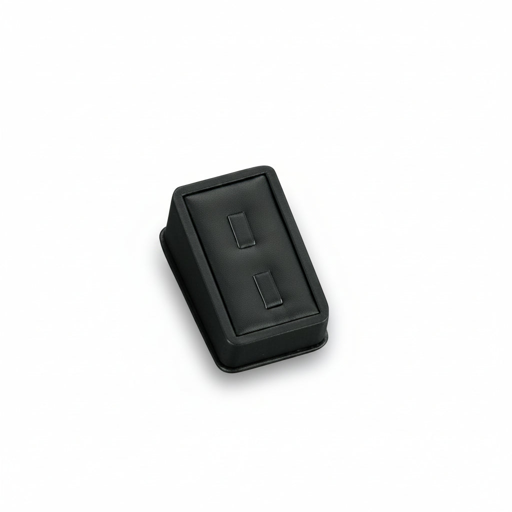 A black leatherette ring stand with two clips on a white background.