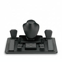 A black leatherette window display set with a central mannequin bust and side accessories holders on a flat base.
