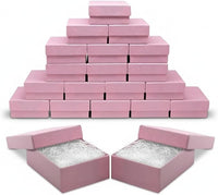 Stack of pink jewelry boxes