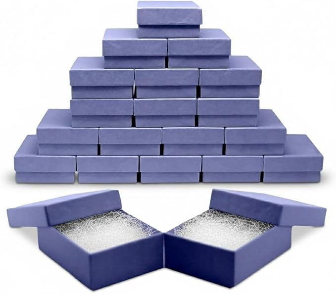 Stack of blue jewelry boxes with a pyramid formation and two open boxes showing interior.