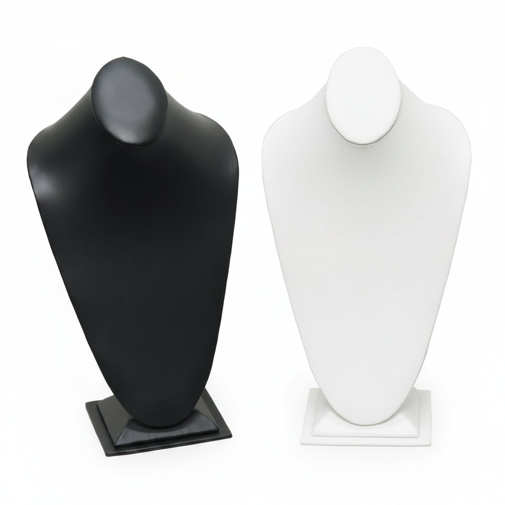 Two necklace displays, one in black and one in white, both with a tall, mannequin-like neck portion, set on a flat base.