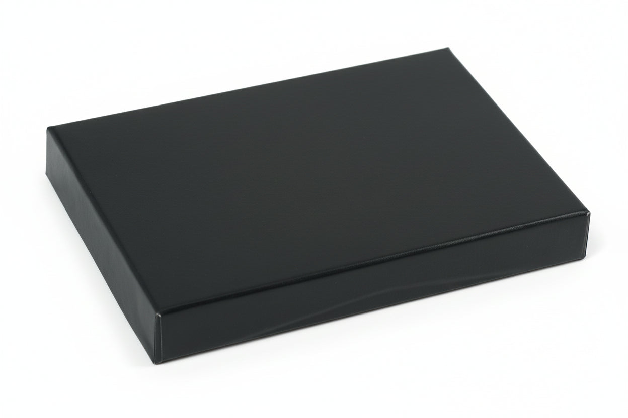 A gloss black presentation pop-up gift card box with a silver interior.