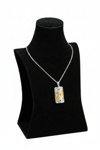 A small black velvet contoured neck display stand with a silver-colored jewelry holder on a mannequin bust.