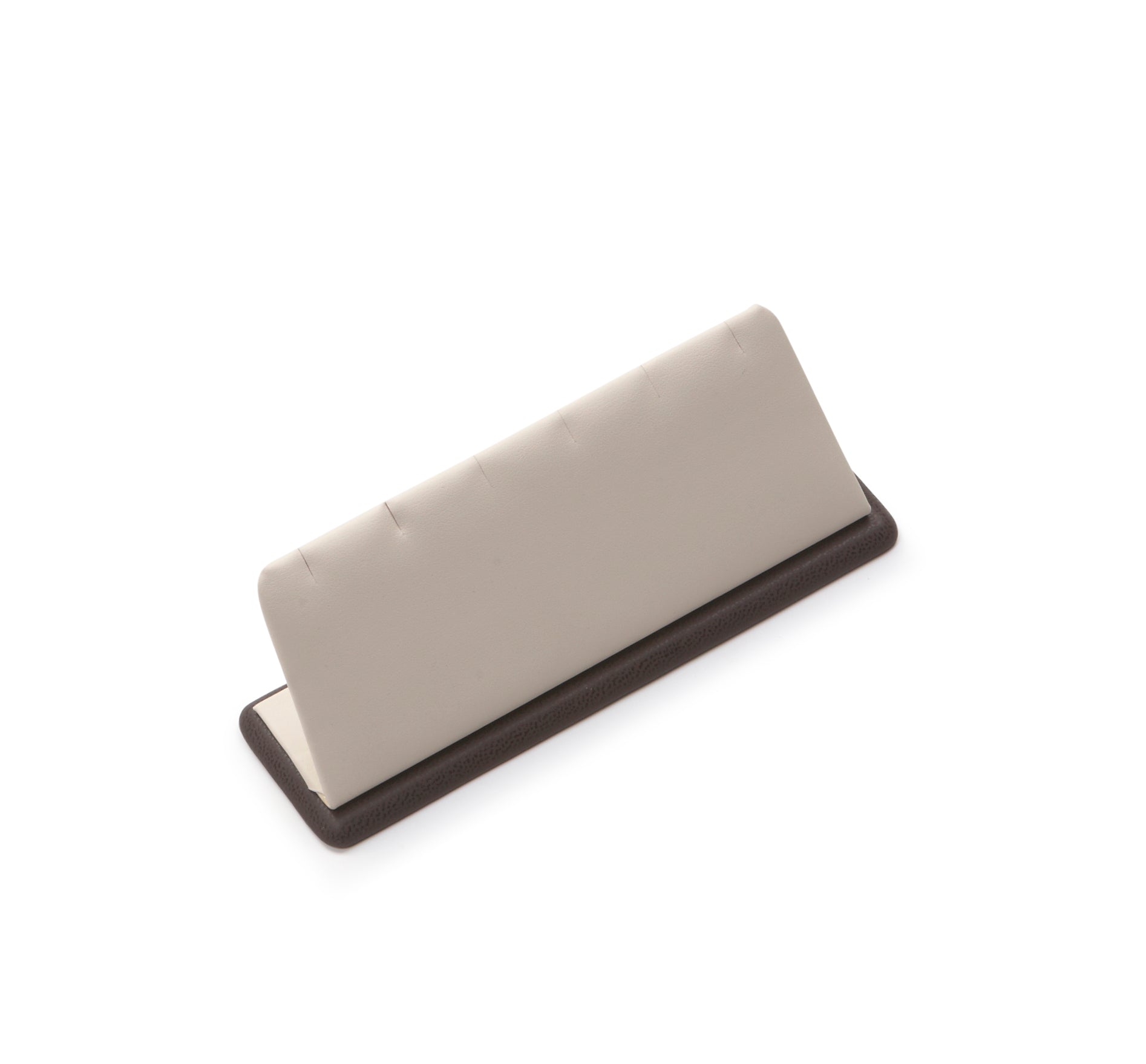 A chocolate and beige leatherette 3 pendant stand designed to hold jewelry items.