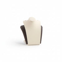 A small pendant stand with a chocolate and beige leatherette finish, designed to hold a pendant securely for display.