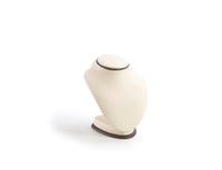 A chocolate and beige leatherette neckform with an oval base designed for displaying necklaces.