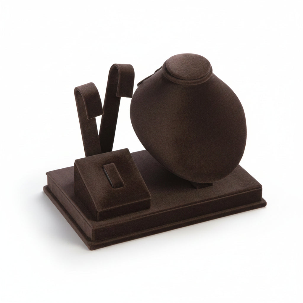 A chocolate leatherette earring/ring/pendant stand with a soft, cushioned surface designed to hold jewelry items securely for display.