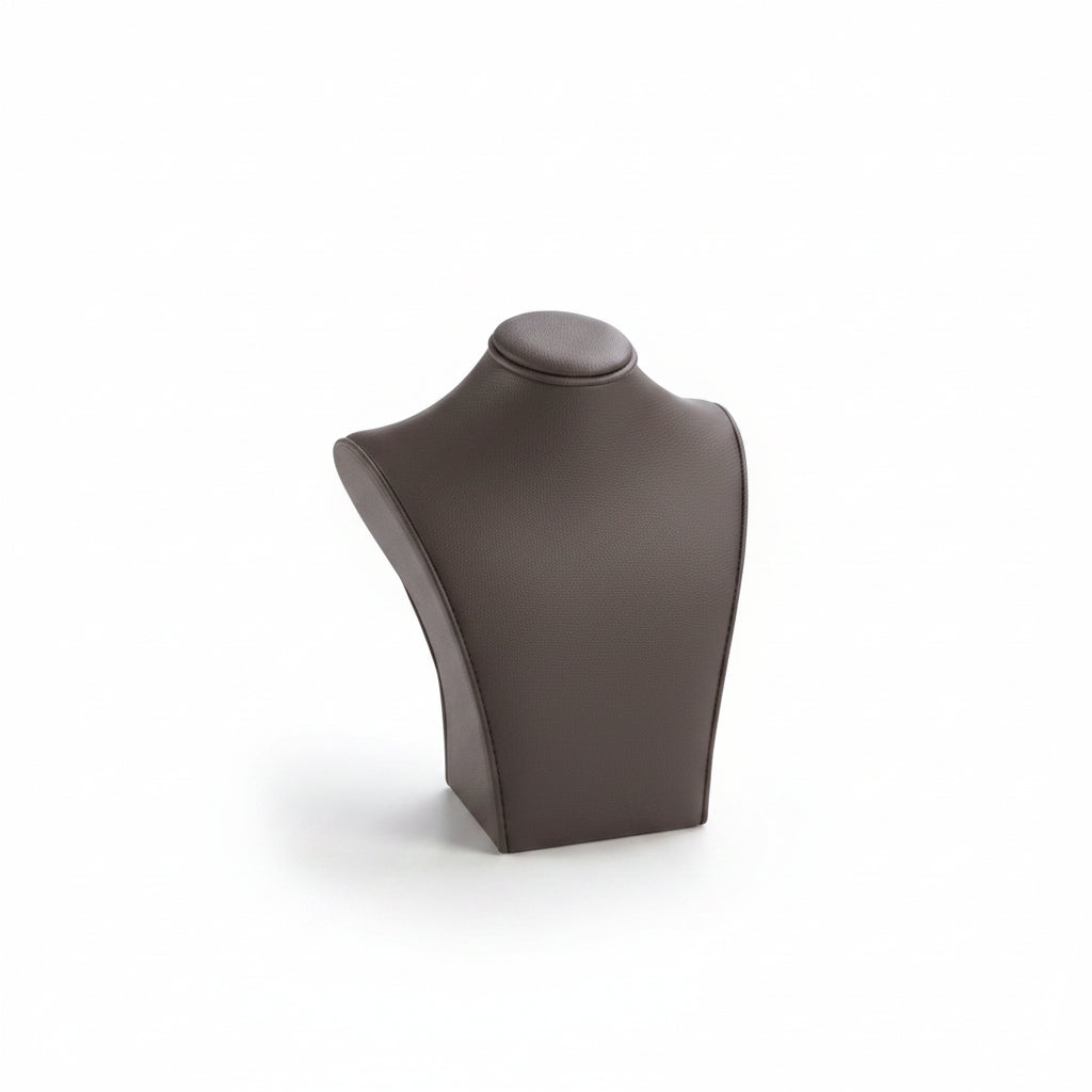 A mannequin torso with a chocolate leatherette finish, designed to display necklaces.
