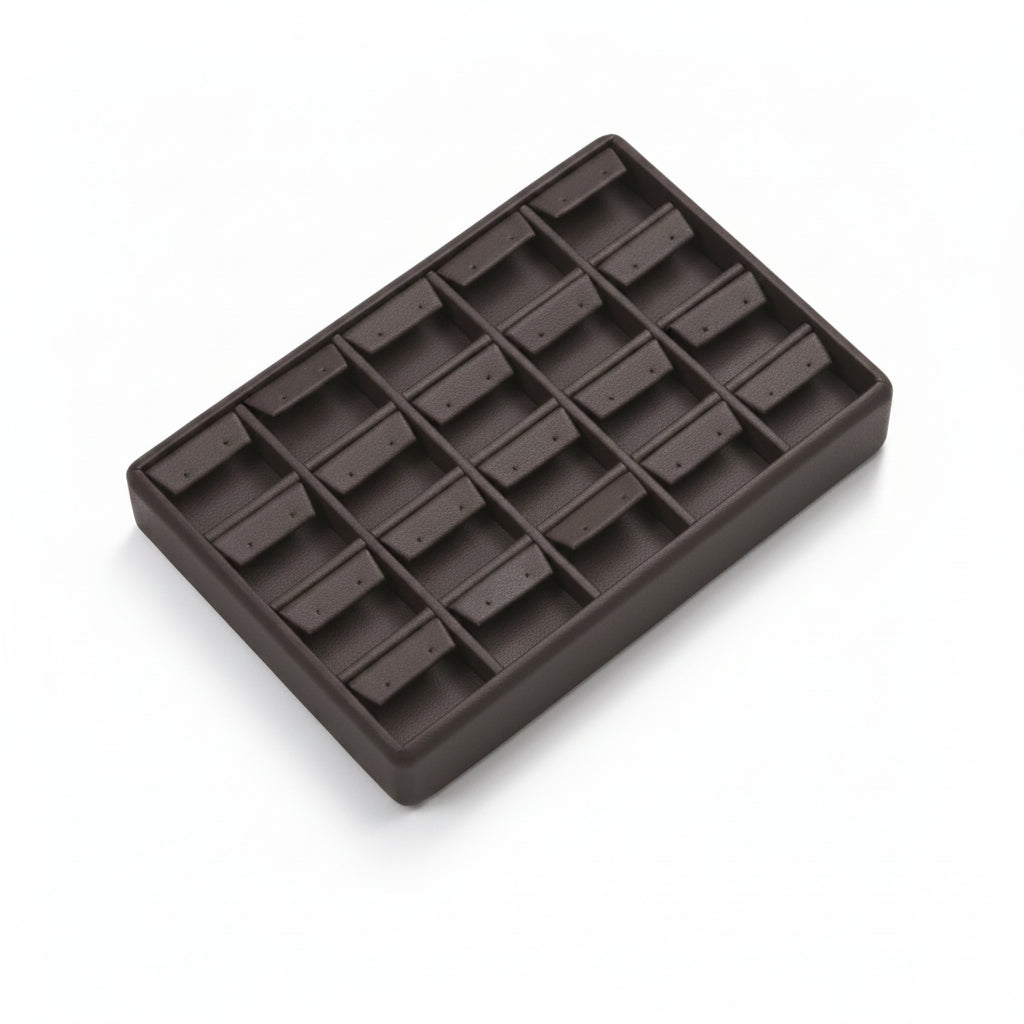 A chocolate leatherette earring tray designed to hold 20 earrings, with a soft, cushioned surface.