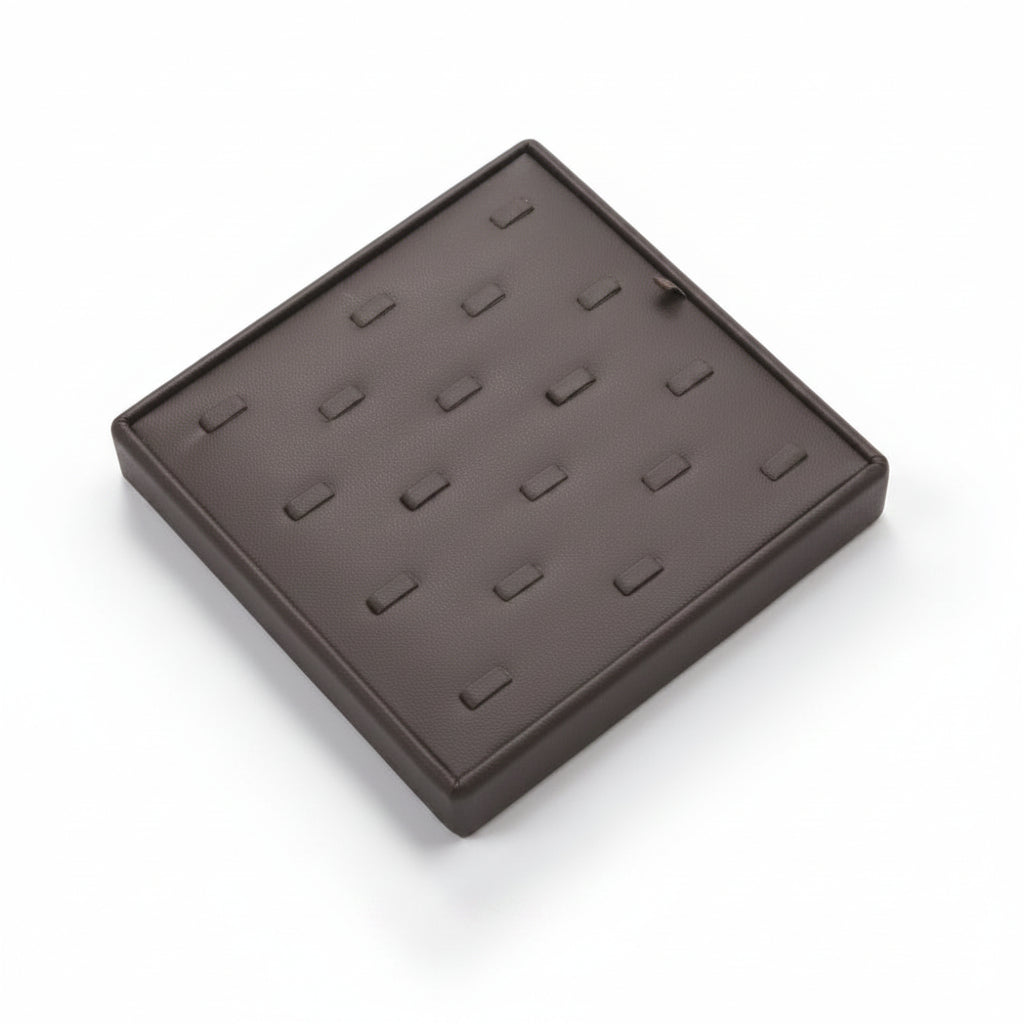 A chocolate leatherette ring display tray with multiple individual clips designed to hold rings securely.