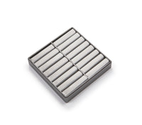 A silver gray leatherette bangle tray designed to hold multiple bangles, with a flat surface and sides.