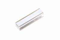 White rectangular object with gold trim on a white background