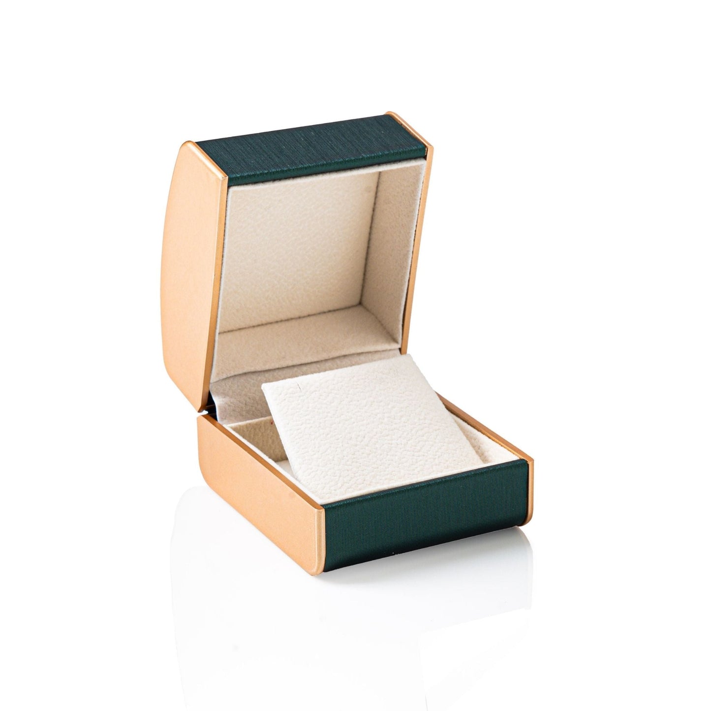Gold and green jewelry box with a white interior on a white background