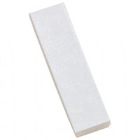 A single white cotton filled jewelry box with a swirl pattern.