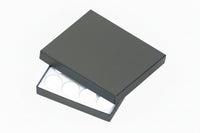 A black tray with a cover and a foam insert containing 16 gem jar compartments.