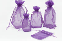 Set of black drawstring bags on a white background