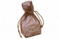 A brown organza drawstring pouch filled with white beads, tied at the top.