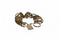 Gold bracelet with a tag on a white background