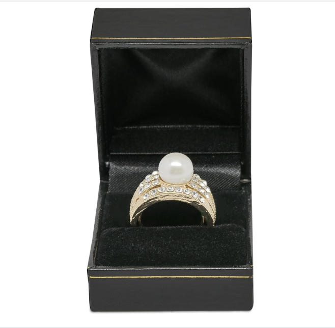 Ring with a pearl in a black jewelry box