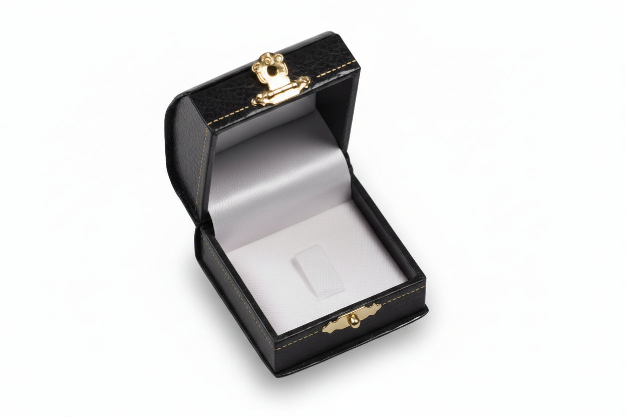 Open jewelry box with gold accents on a white background