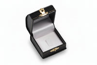 Open jewelry box with gold accents on a white background