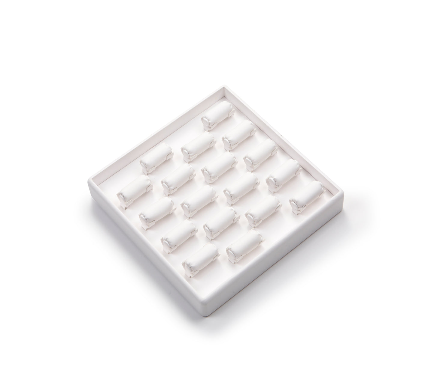 Set of small white dog figurines in a clear plastic display case on a white background