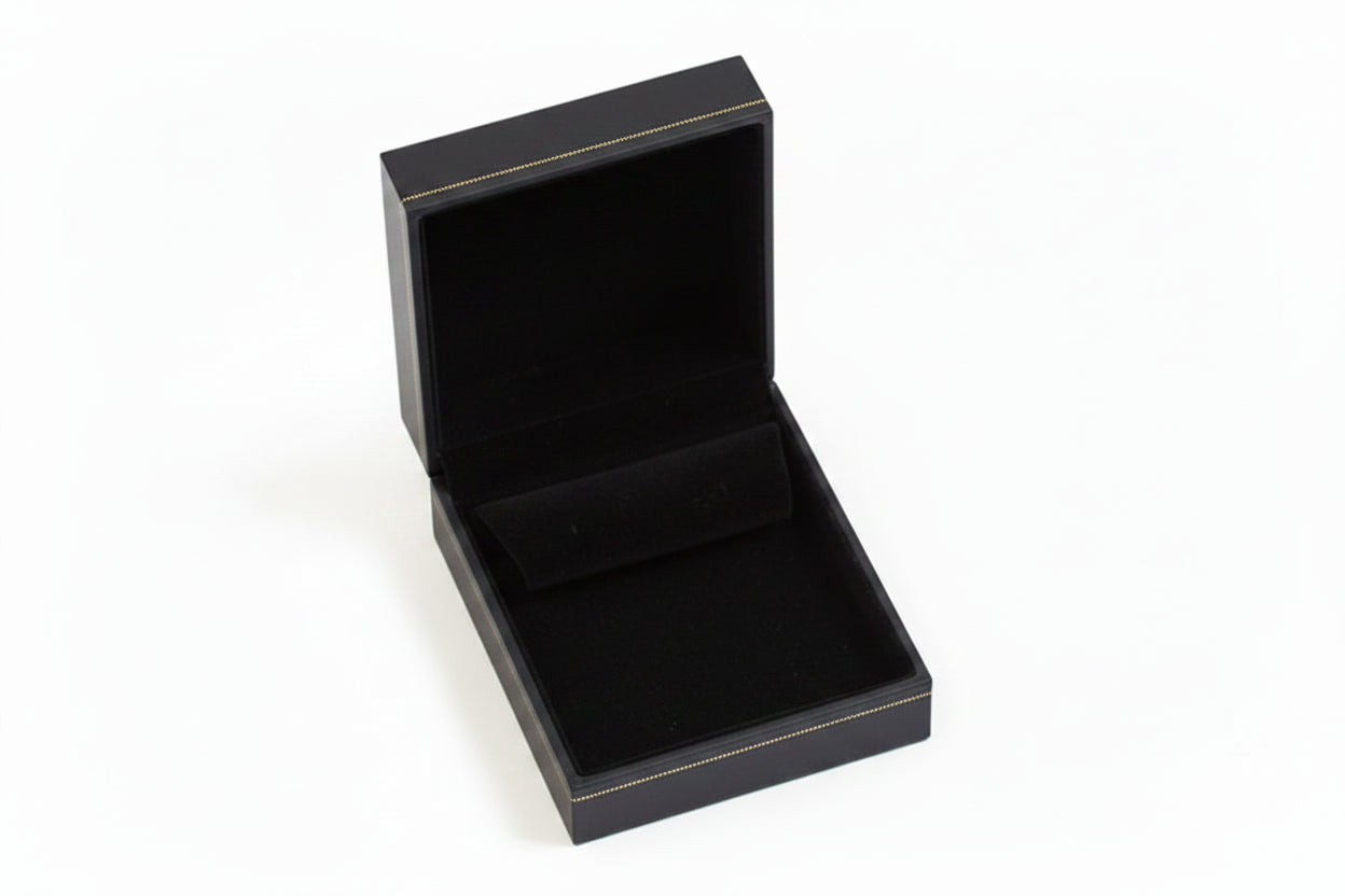 Open Black jewelry box with gold trim