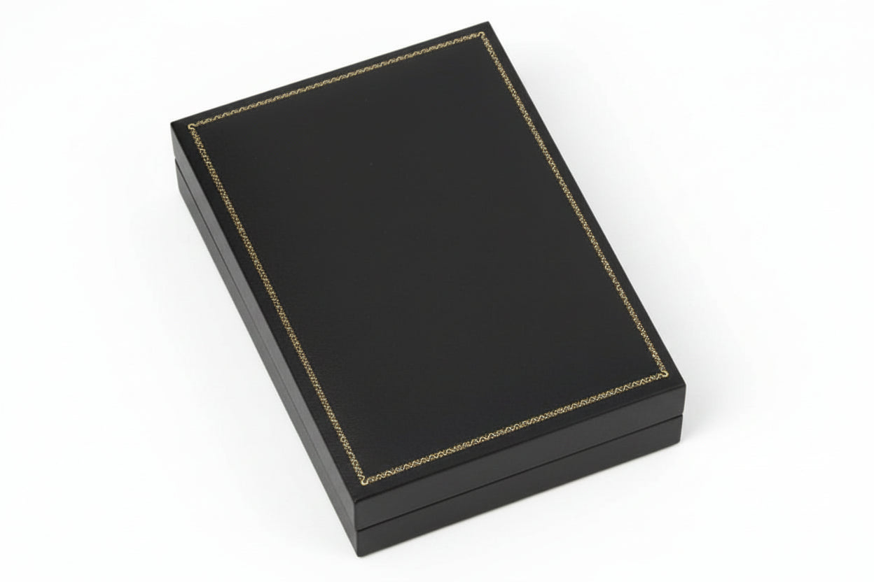 Red leather-bound book on a white background