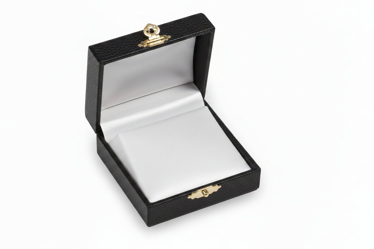 Open black burgundy velvet jewelry box with gold accents 