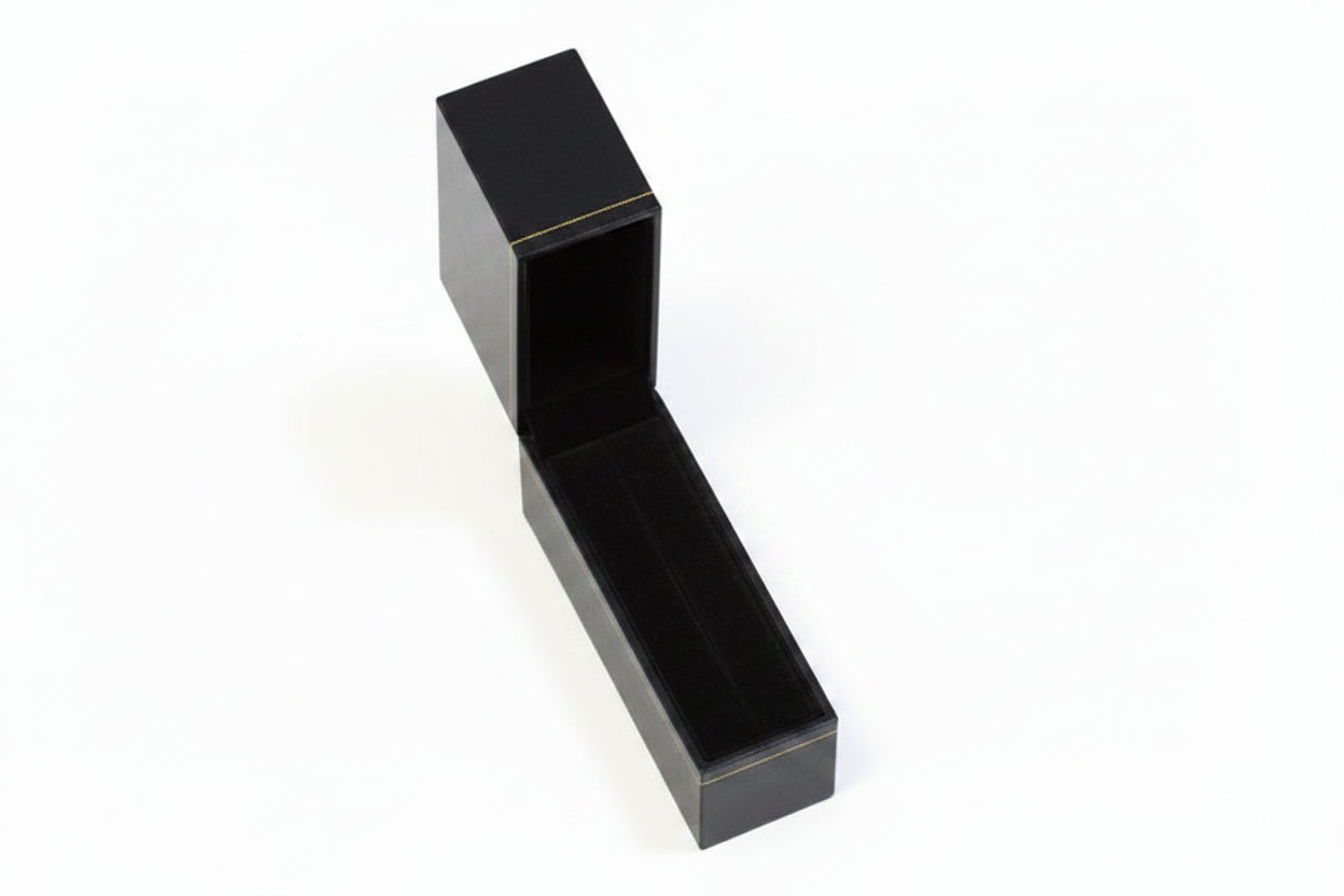 Red jewelry box with a white interior on a white background