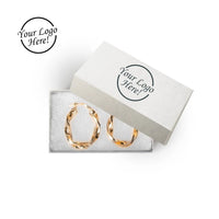 Earrings in a branded white box with 'Your Logo Here!' text.