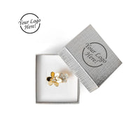 Silver floral earring in a branded box with 'Your Logo Here' text.