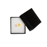 Flower-shaped earring in a black jewelry box