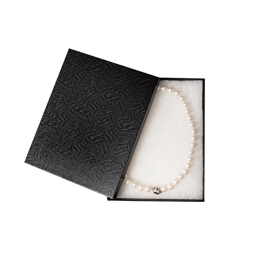 Pearl necklace in a black jewelry box