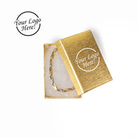 Gold bracelet in an open box with 'Your Logo Here!' text 