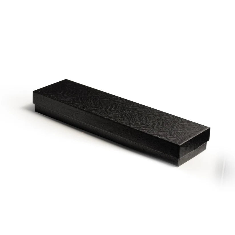 Black rectangular box with textured surface 
