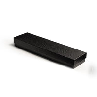 Black rectangular box with textured surface 