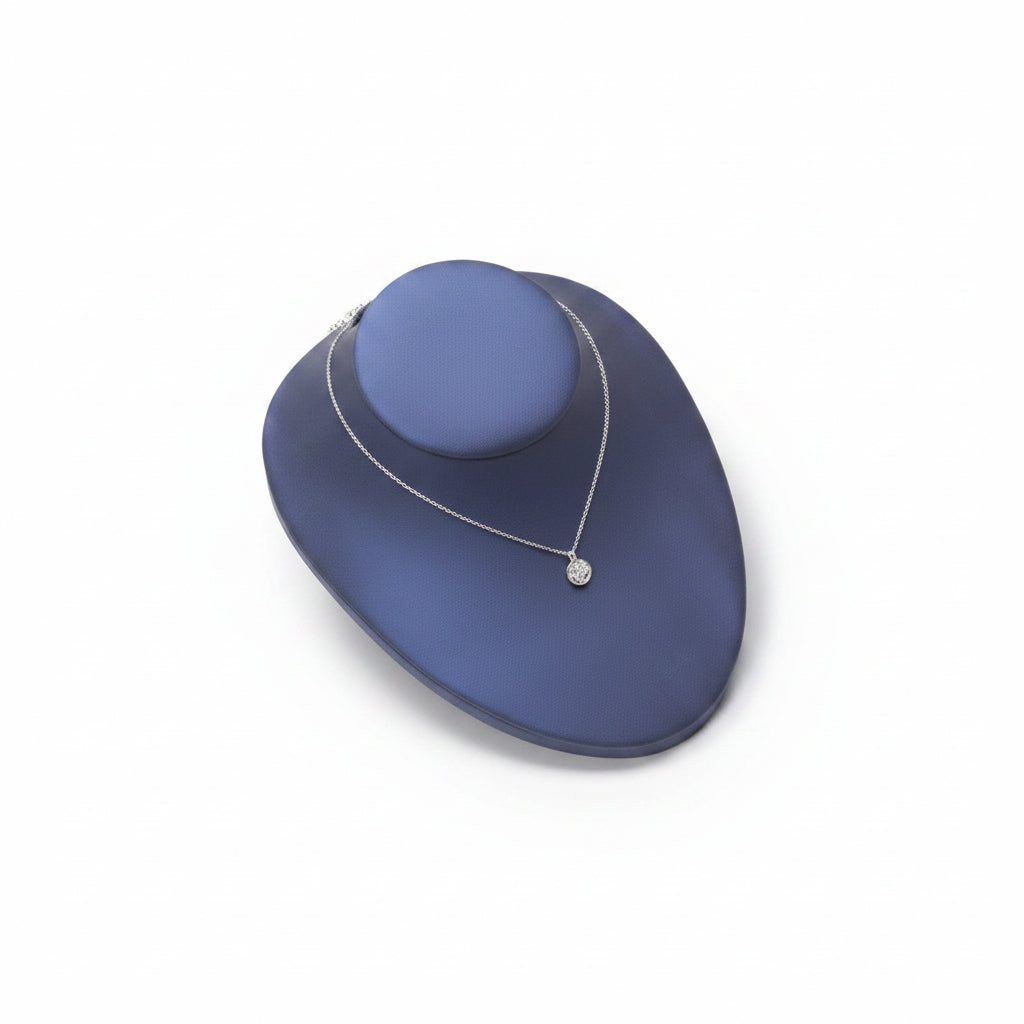Navy blue leatherette mannequin head for displaying jewelry.