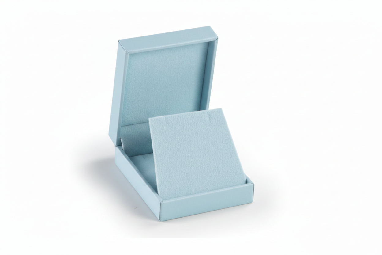 A light blue leatherette pendant box with its lid open, showing a light blue suede interior.