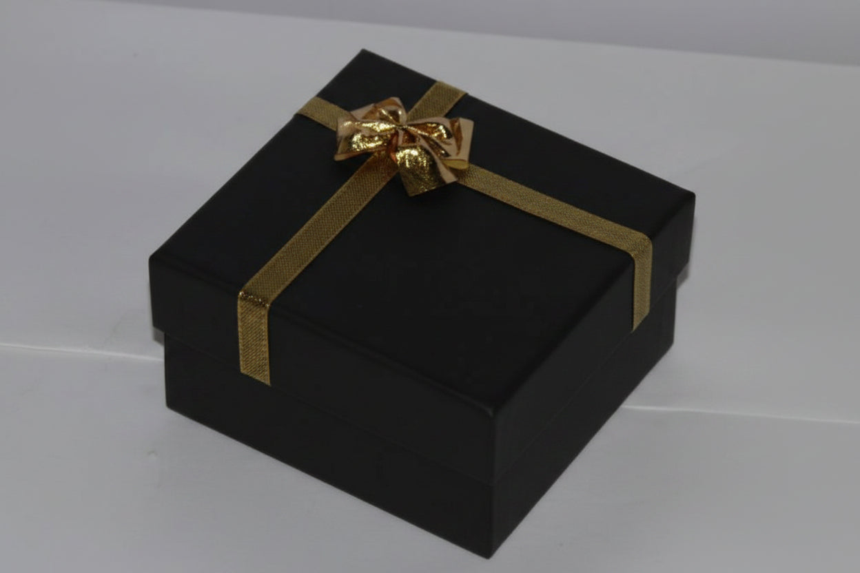 Black  gift box with a gold ribbon